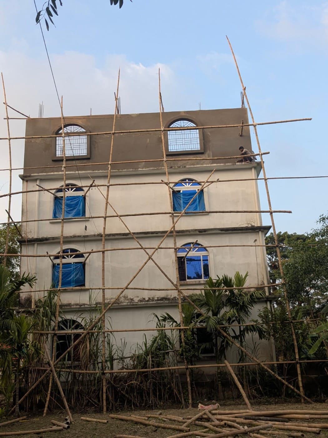 Jamia Islamia Hadiqatul Quran building under construction with scaffolding on the upper floors