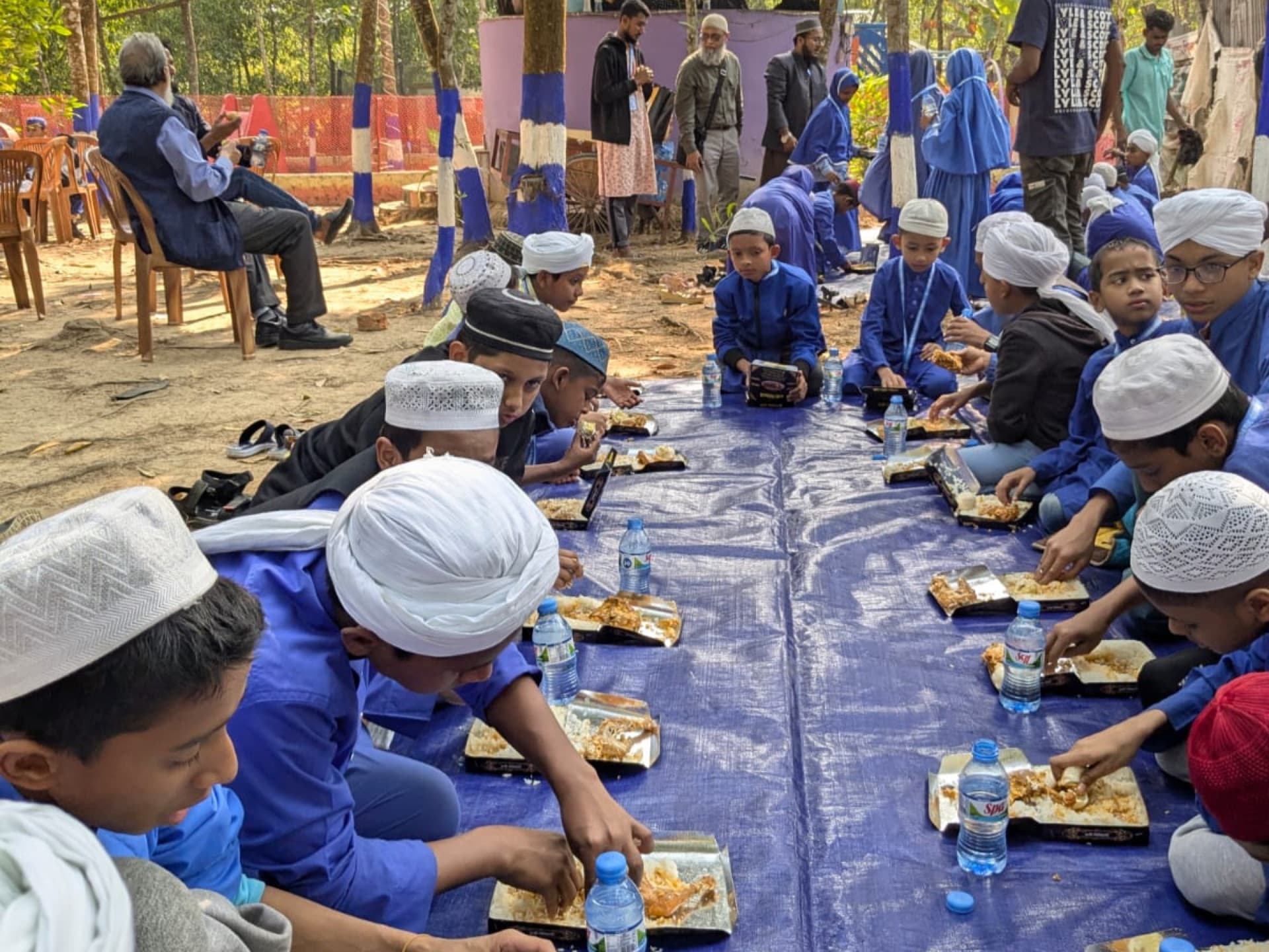 Students using computers as part of the Blended Madrasa Education programme